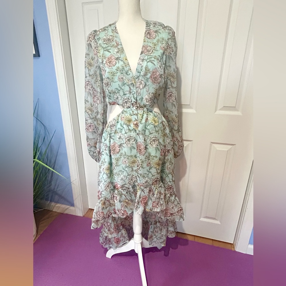 Brand new Hi low flowered dress with cutout middle. Lined